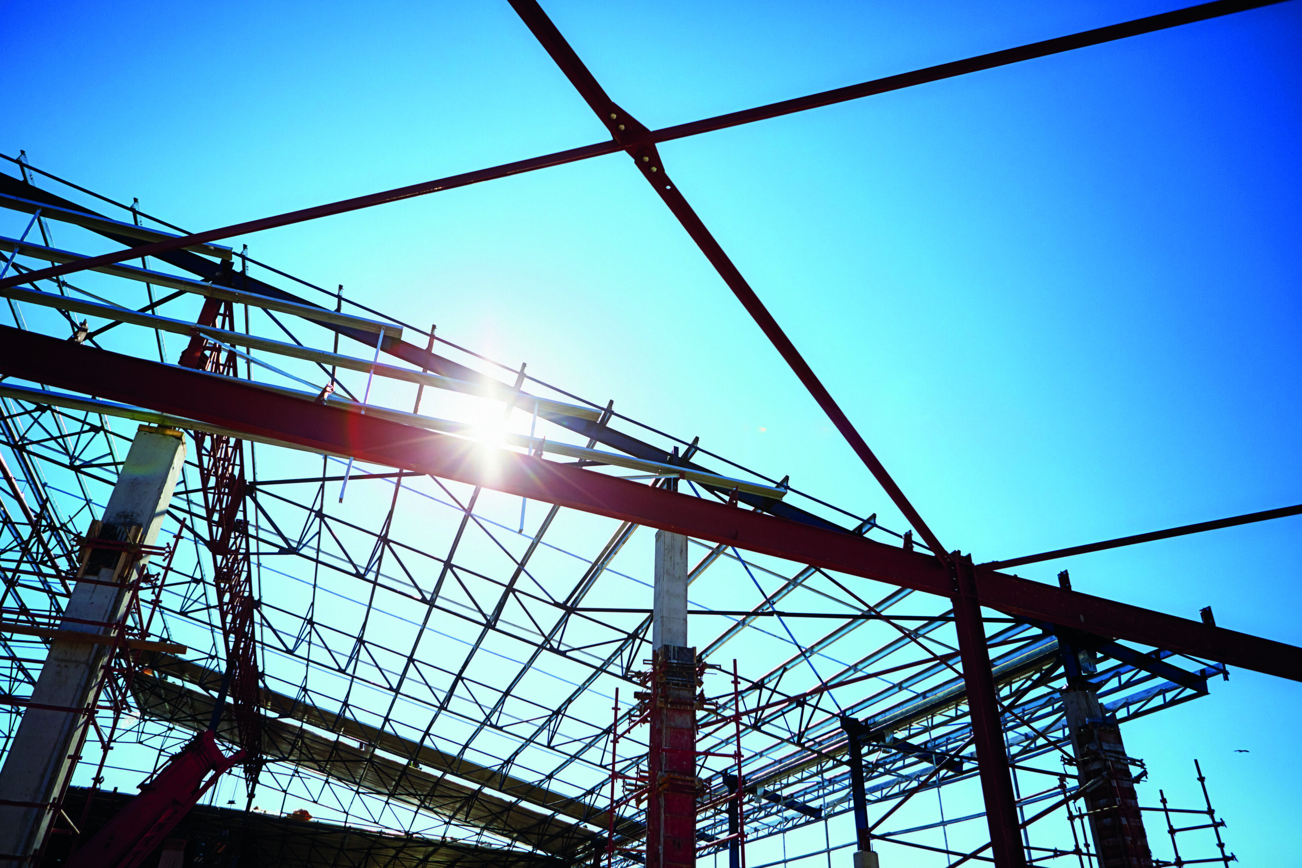 Low angle view of the roof frame of a warehouse under construction